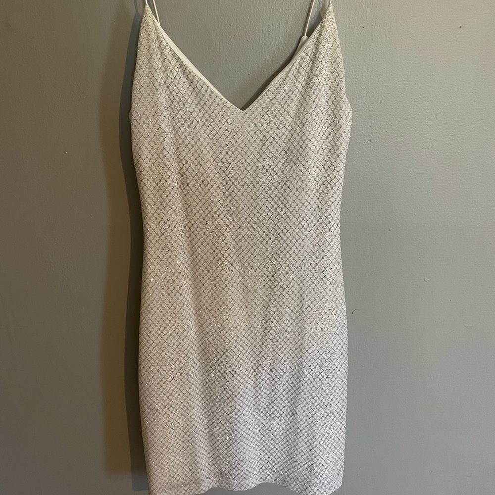 Short white dress with silver details. Size medium. From Macy’s